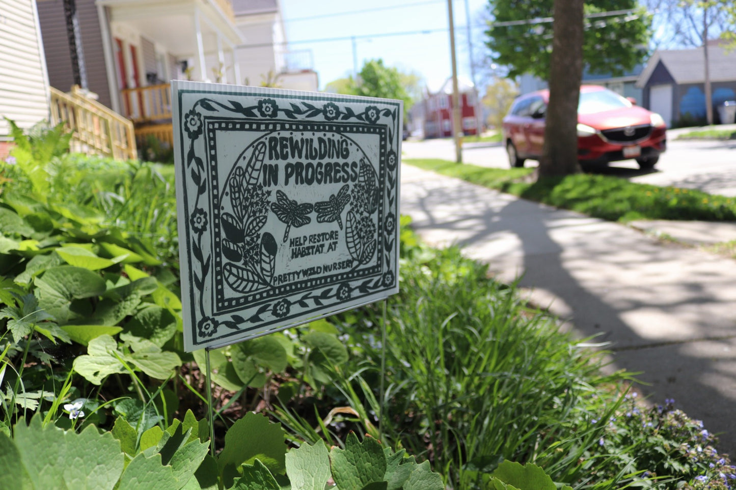 Rewilding In Progress yard sign
